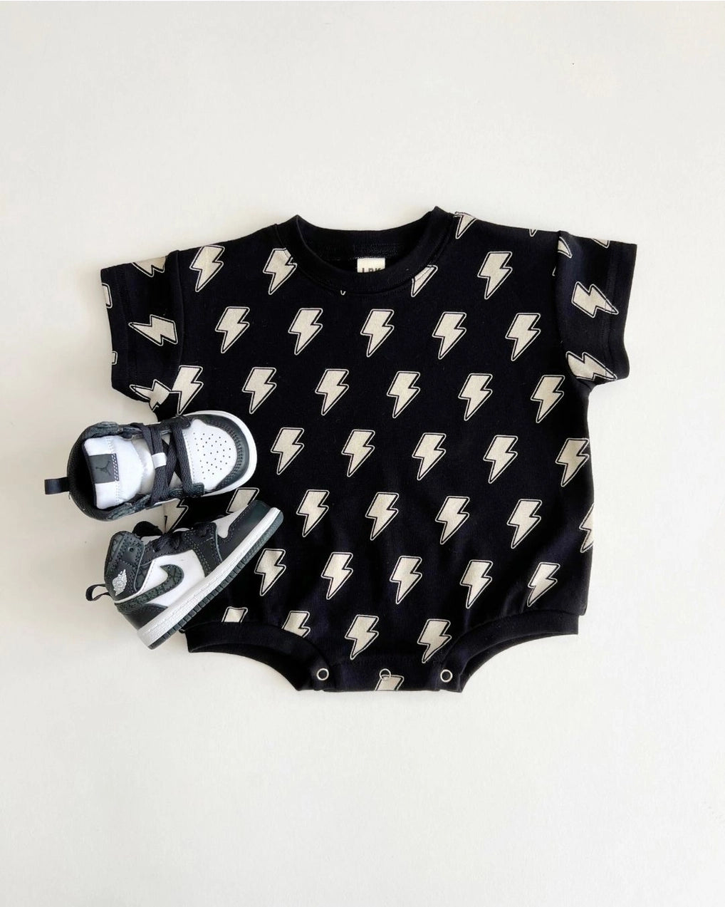 Short Sleeve Bubble Romper | Black Bolts - PREORDER